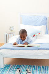 Little boy reading a book