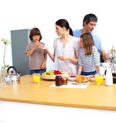 Jolly young family having a breakfast