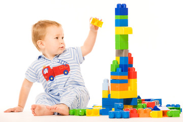 Little boy builds building