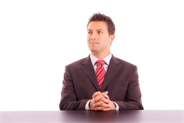 Young business man on a desk, isolated on white