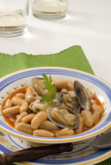 Spanish Cuisine. Asturian clams and beans.