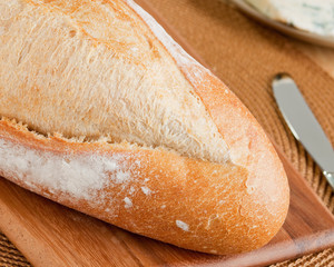 Crisp fresh french bread loaf ready to be cut