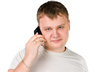 Handsome young guy speaking on cellphone on white