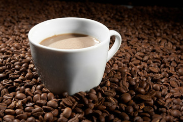 Cup with coffee, costing on coffee grain