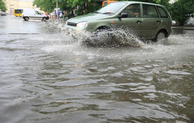Car on Very Wet Road