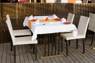 Table and chairs in empty cafe