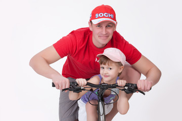 Obraz premium Father And Daughter On The Bicycle