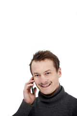 Friendly modern young guy talking on mobile phone