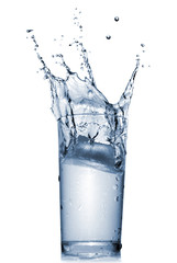 water splash in glass isolated on white