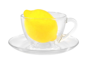 Fresh lemon in a transparent glass cup