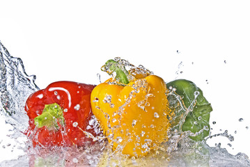 Fototapeta na wymiar red, yellow and green pepper with water splash isolated on white