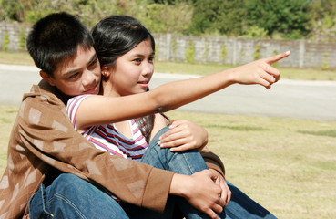 Young couple pointing