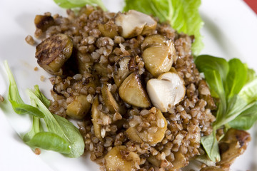 Buckwheat porridge with mushrooms on plate