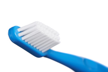 A blue  tooth brush on the white background