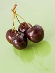 cherry isolated on green