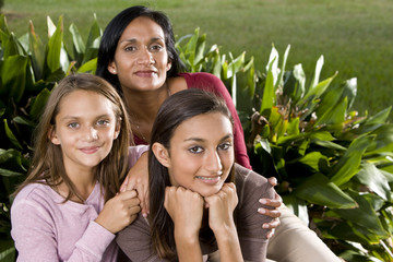Family portrait, mother with two beautiful daughters