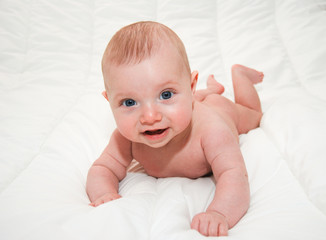 baby on white bed