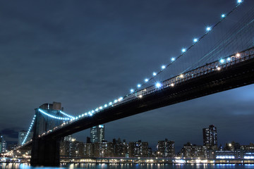 Fototapeta na wymiar Brooklyn Bridge and Manhattan skyline at Night - New York City