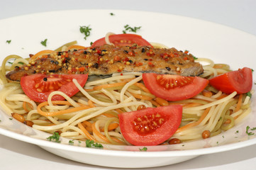spaghetti with peppered mackerel on a plate