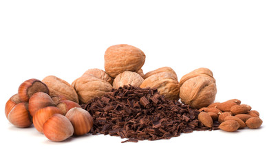 grated chocolate and nuts isolated on white background