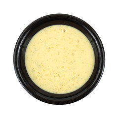 Cream of broccoli soup in black bowl