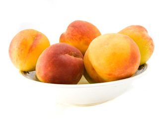 peaches on plate isolated