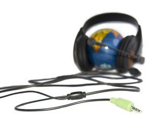 Headset on world globe isolated