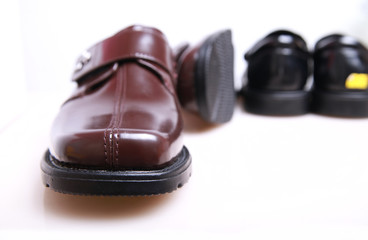 Luxury Shiny Brown Leather Dress Shoes on White Background

