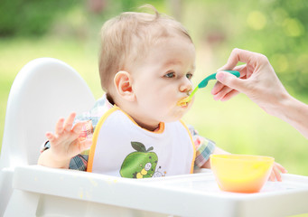 Mother feed her lovely baby