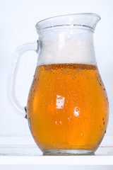 dewy pitcher of beer in the fridge