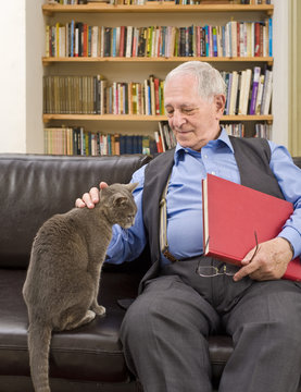 Senior Man And Cat