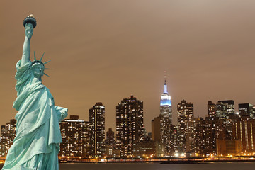 New York City Skyline and The Statue of Liberty at Night