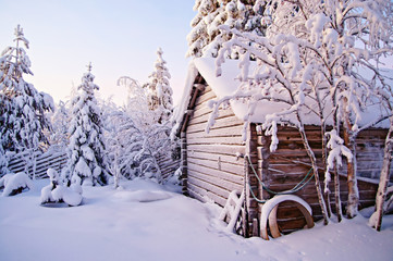 House in the snowy woods of Lapland, Finland