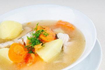 tasty fish soup with greens and carrots