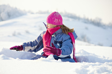 happy child play at winter snow