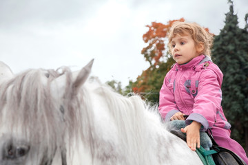 teen girl riding horse