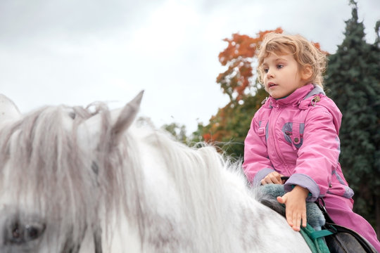 Teen Girl Riding Horse