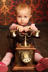 Portrait of girl with retro phone. Interior in retro style