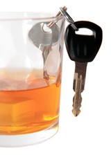 car keys inside bourbon glass