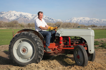 farmer riding tractor