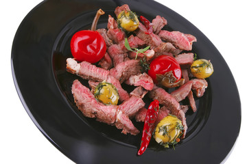 beef meat served on black