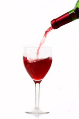 Red wine poured in a glass.