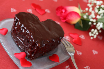 Heart shaped chocolate cake and rose