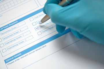 Doctor Completing Pathology Request Form