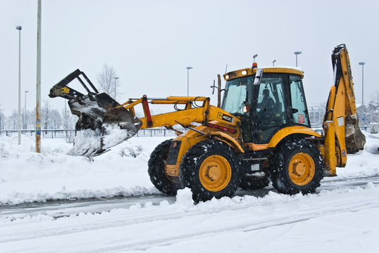 Yellow Snow Plow Cleaning A Road