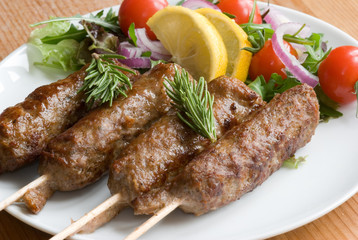 Lamb kebab with salad