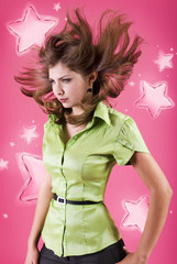 studio portrait of a sweet girl with flying hair