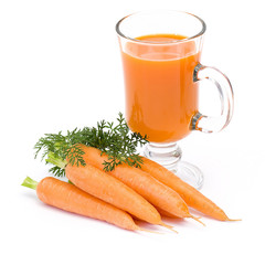 glass of fresh carrots juice and some fresh carrots