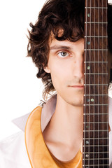Close-up portrait of a young man with electric guitar