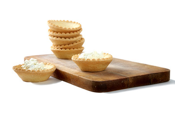 Fototapeta na wymiar Tartlets with soft cheese isolated